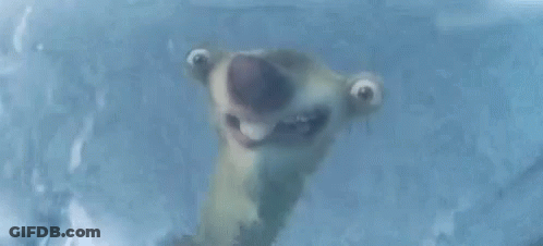 A Cartoon Character Is Making A Funny Face While Standing In Ice . GIF