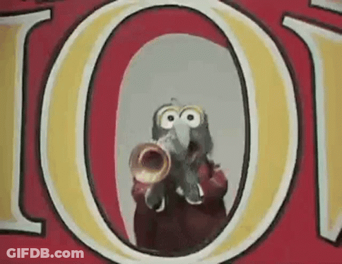 A Cartoon Character Is Playing A Trumpet In Front Of A Red And Yellow Sign . GIF