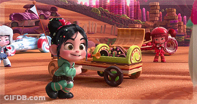 A Cartoon Character Is Pushing A Cart Full Of Candy In A Candy Land GIF