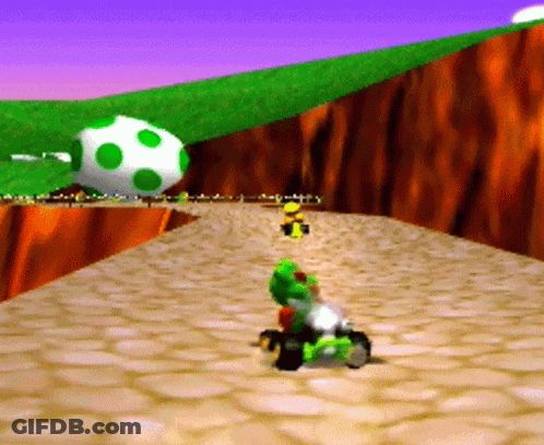 A Cartoon Character Is Riding A Kart On A Rocky Road . GIF