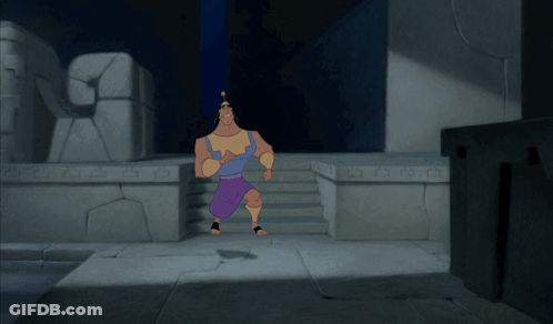 A Cartoon Character Is Running In A Dark Room With A Stone Wall Behind Him That Says ' A ' On It GIF