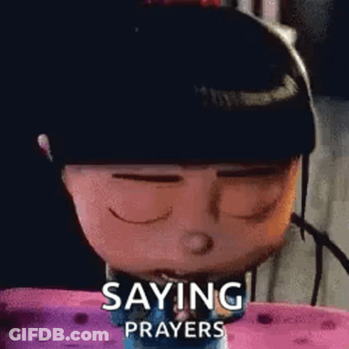 A Cartoon Character Is Saying Prayers While Sitting On A Bed . GIF