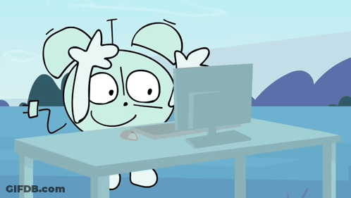 A Cartoon Character Is Sitting At A Desk With A Computer GIF