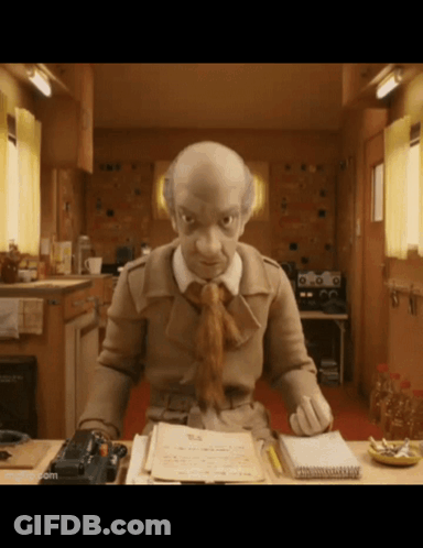 A Cartoon Character Is Sitting At A Desk With A Notebook And A Pen GIF