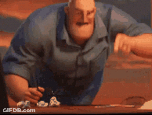 A Cartoon Character Is Sitting At A Table With A Bunch Of Crumpled Paper . GIF