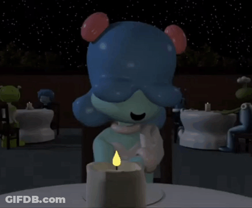 A Cartoon Character Is Sitting At A Table With A Candle Lit Up GIF