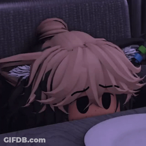 A Cartoon Character Is Sitting At A Table With A Plate In Front Of Him GIF