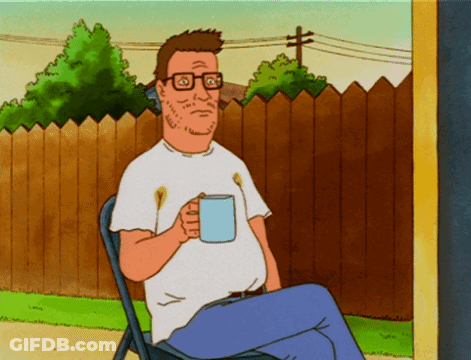 A Cartoon Character Is Sitting In A Chair Holding A Cup GIF