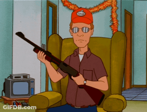 A Cartoon Character Is Sitting In A Chair Holding A Rifle GIF