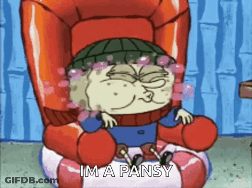A Cartoon Character Is Sitting In A Chair With The Words I 'M A Pansy Below Him GIF