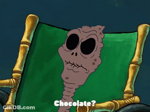 A Cartoon Character Is Sitting In A Chair With The Words " I Remember When They First Invented Chocolate " GIF