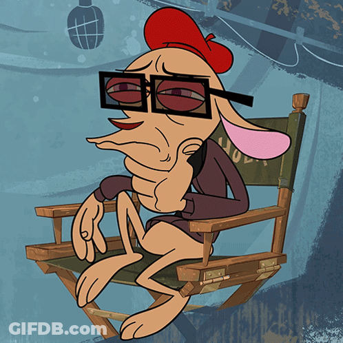 A Cartoon Character Is Sitting In A Directors Chair GIF