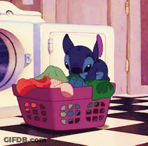 A Cartoon Character Is Sitting In A Purple Laundry Basket GIF