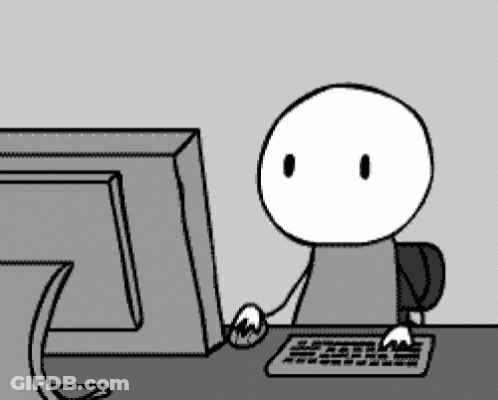A Cartoon Character Is Sitting In Front Of A Computer Monitor GIF