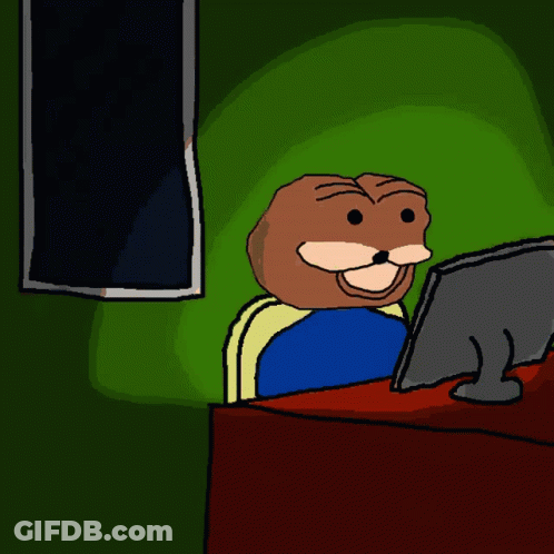 A Cartoon Character Is Sitting In Front Of A Computer Screen GIF