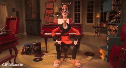 A Cartoon Character Is Sitting In Front Of A Piano And Has A Pair Of Monkey Slippers On GIF
