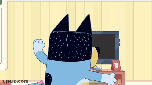 A Cartoon Character Is Sitting In Front Of A Television In A Living Room GIF
