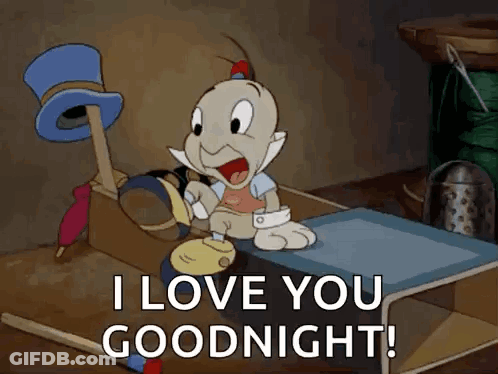 A Cartoon Character Is Sitting On A Bed Saying I Love You Goodnight . GIF