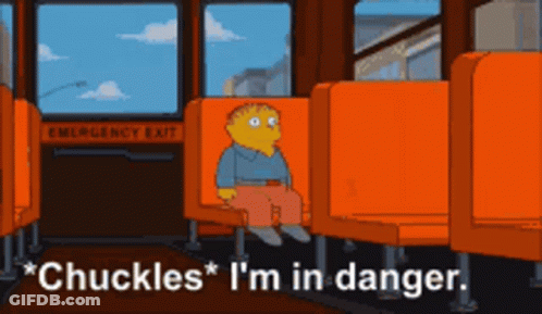 A Cartoon Character Is Sitting On A Bus With The Words " Chuckles I 'M In Danger " GIF
