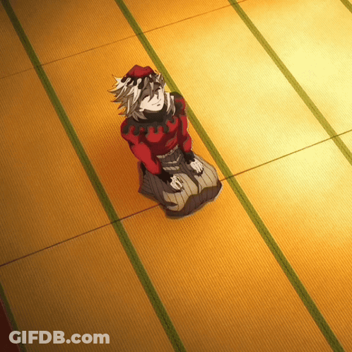 A Cartoon Character Is Sitting On A Carpeted Floor GIF