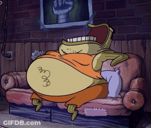 A Cartoon Character Is Sitting On A Couch With A Picture Of A Fist Behind Him GIF