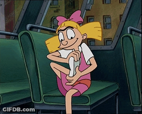 A Cartoon Character Is Sitting On A Green Seat And Smiling GIF