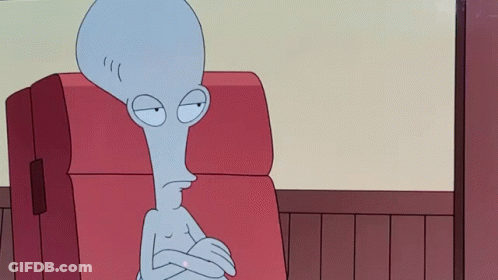Cartoon Character Sitting On Red Couch With Crossed Arms GIF