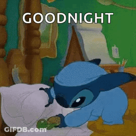 A Cartoon Character Is Sleeping In A Bed With A Turtle And The Words `` Goodnight '' . GIF