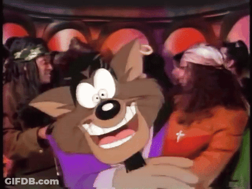 A Cartoon Character Is Smiling And Holding A Microphone In Front Of A Group Of People GIF