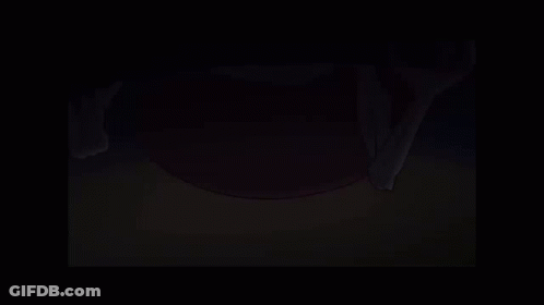 A Cartoon Character Is Standing In A Dark Room Holding A Broom . GIF