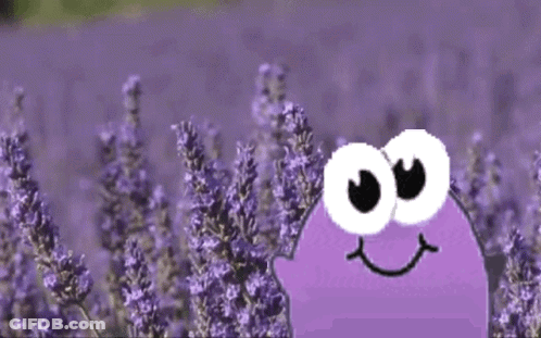 A Cartoon Character Is Standing In A Field Of Lavender Flowers GIF
