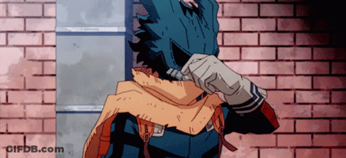A Cartoon Character Is Standing In Front Of A Brick Wall And Covering His Face GIF