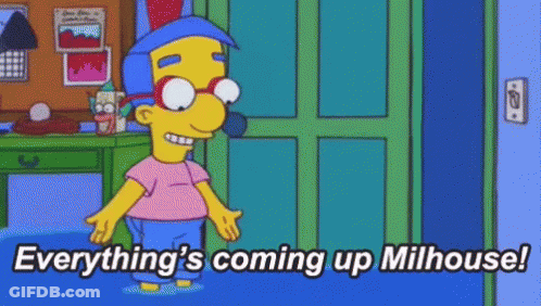 A Cartoon Character Is Standing In Front Of A Door With The Words `` Everything 'S Coming Up Milhouse ! '' GIF