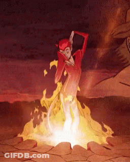 A Cartoon Character Is Standing In Front Of A Fire In The Desert GIF