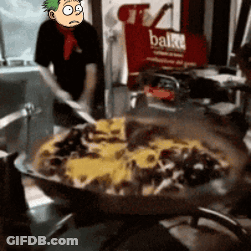 A Cartoon Character Is Standing In Front Of A Large Pizza And A Sign That Says Bake GIF