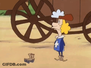 A Cartoon Character Is Standing In Front Of A Wagon Wheel GIF