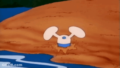 A Cartoon Character Is Standing In The Dirt Near A Body Of Water . GIF