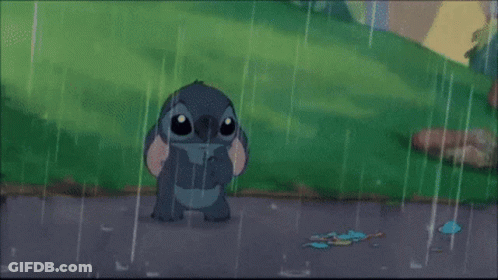 A Cartoon Character Is Standing In The Rain With A Broken Key On The Ground GIF