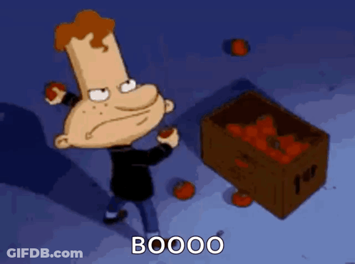 A Cartoon Character Is Standing Next To A Box Of Tomatoes And Saying Booo GIF