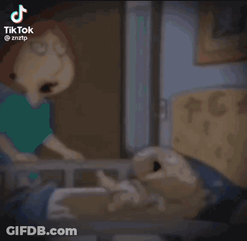 A Cartoon Character Is Standing Next To A Cartoon Character In A Bed . GIF