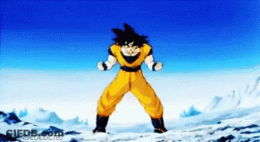 A Cartoon Character Is Standing On A Snow Covered Mountain . GIF