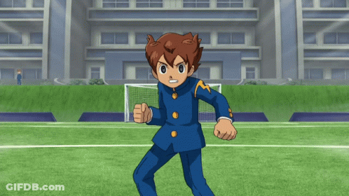 A Cartoon Character Is Standing On A Soccer Field In Front Of A Building GIF