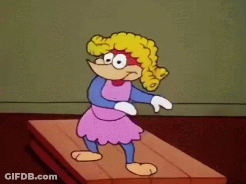 A Cartoon Character Is Standing On A Wooden Surface GIF