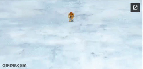 A Cartoon Character Is Standing On Top Of A Snow Covered Hill . GIF