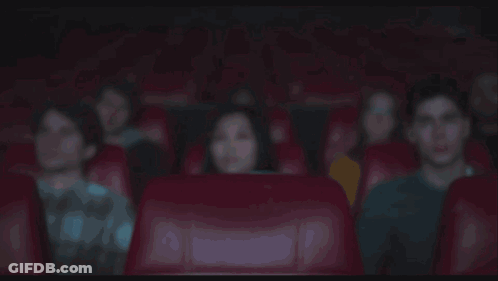 A Cartoon Character Is Surrounded By Flames While People Watch GIF