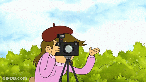 A Cartoon Character Is Taking A Picture With A Camera On A Tripod GIF