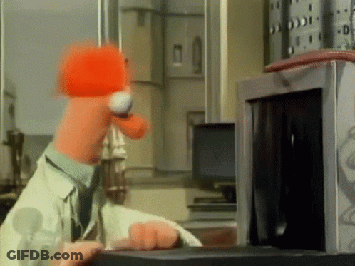 A Cartoon Character Is Using A Microwave Oven GIF