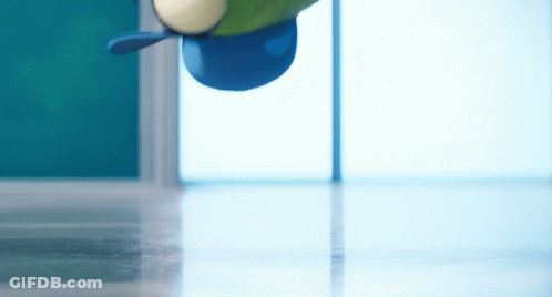 A Cartoon Character Is Wearing A Blue Hat And Flying Through The Air . GIF