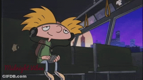 A Cartoon Character Is Wearing Headphones While Sitting On A Bus . GIF