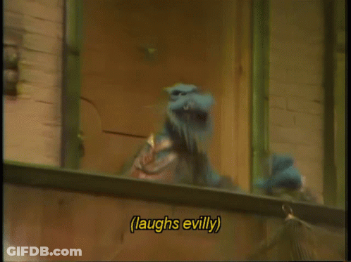 A Cartoon Character Laughs Evilly While Looking Out Of A Window GIF